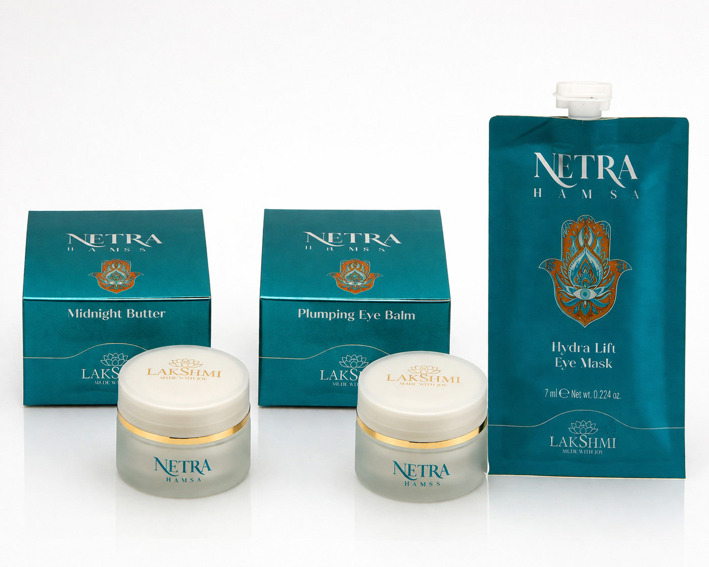 Lakshmi NETRA Midnight Butter, Plumping Eye Balm and Hydra Lift Eye Mask lined up with their boxes