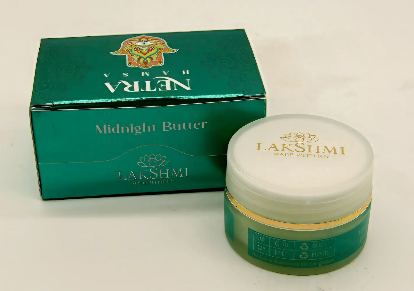 Lakshmi NETRA Midnight Butter green box beside the open jar