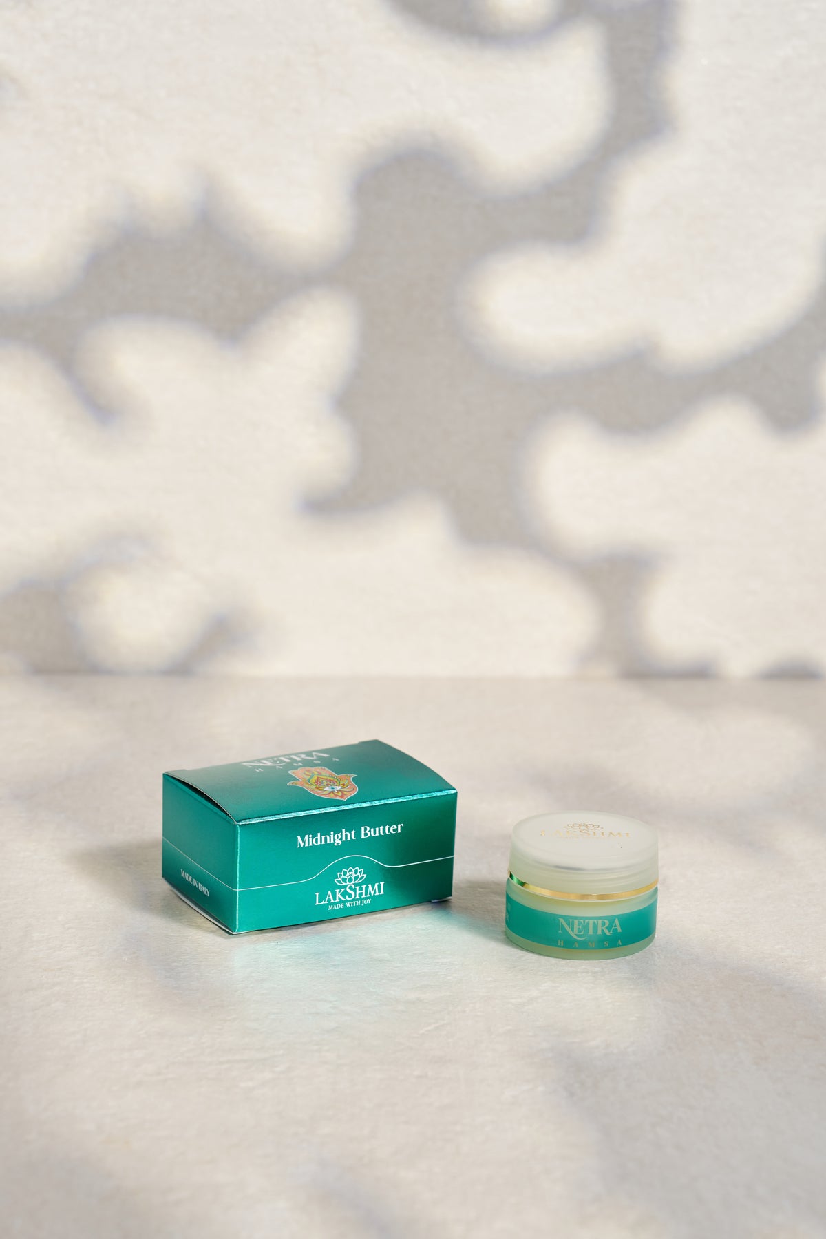 Lakshmi NETRA Midnight Butter jar standing beside its teal box