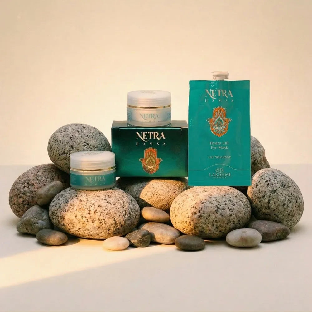 The Lakshmi NETRA eye care range arranged on smooth river stones