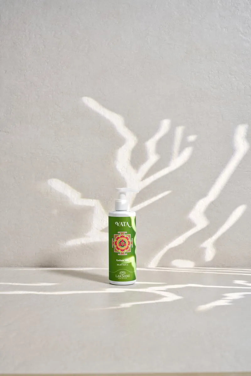 Lakshmi VATA Radiant Milk 200 ml pump bottle in dappled light