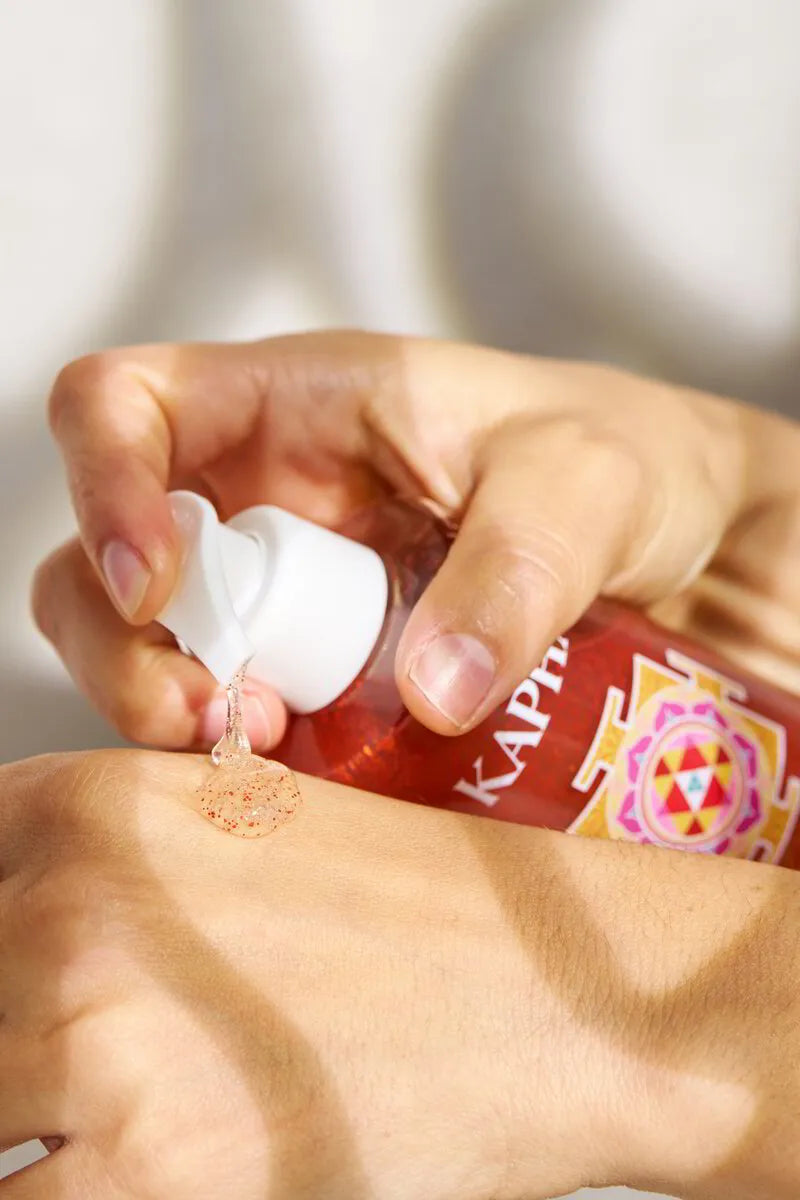 Hand dispensing Lakshmi KAPHA Pure Gel onto the back of a hand