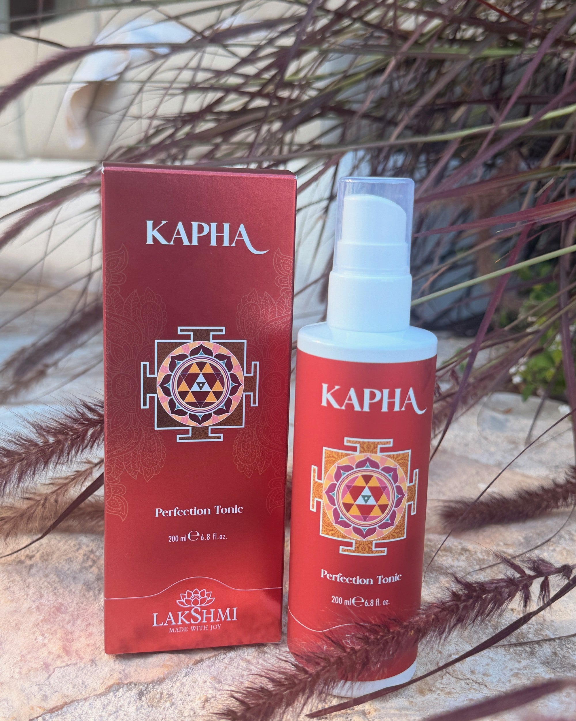 Lakshmi KAPHA Perfection Tonic on sunlit Puglia stone
